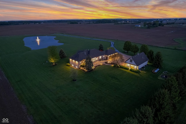 aerial view at dusk featuring a rural view