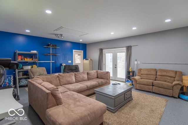 living area with french doors, attic access, and recessed lighting