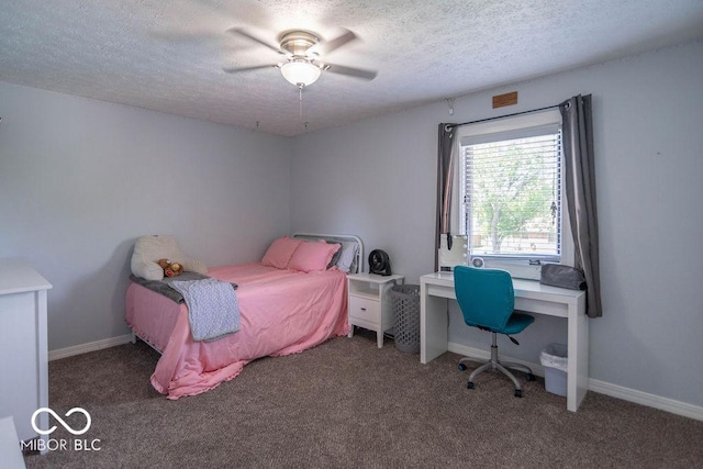 carpeted bedroom featuring a ceiling fan, a textured ceiling, and baseboards