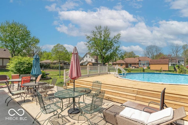 outdoor pool with a deck