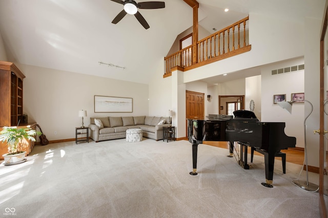 living area with carpet flooring, ceiling fan, visible vents, and baseboards