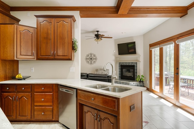kitchen featuring stainless steel dishwasher, a ceiling fan, a peninsula, open floor plan, and a sink