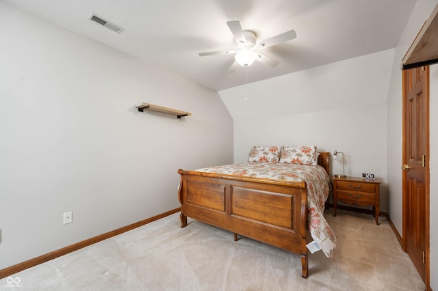 bedroom with ceiling fan, light colored carpet, visible vents, vaulted ceiling, and baseboards