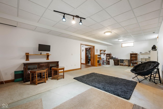 interior space with baseboards and rail lighting