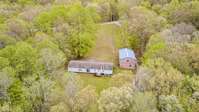 bird's eye view featuring a wooded view