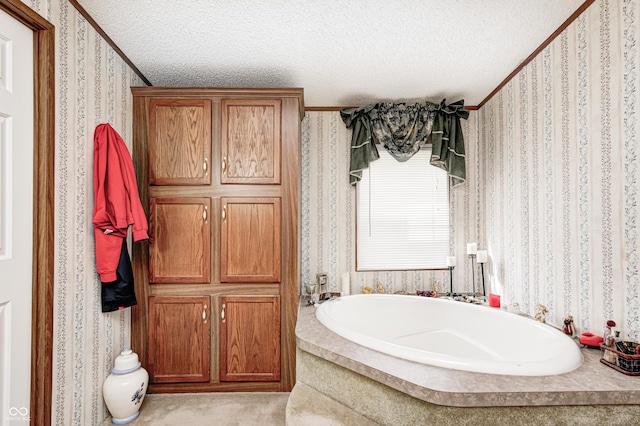 full bathroom featuring a bath, wallpapered walls, and a textured ceiling