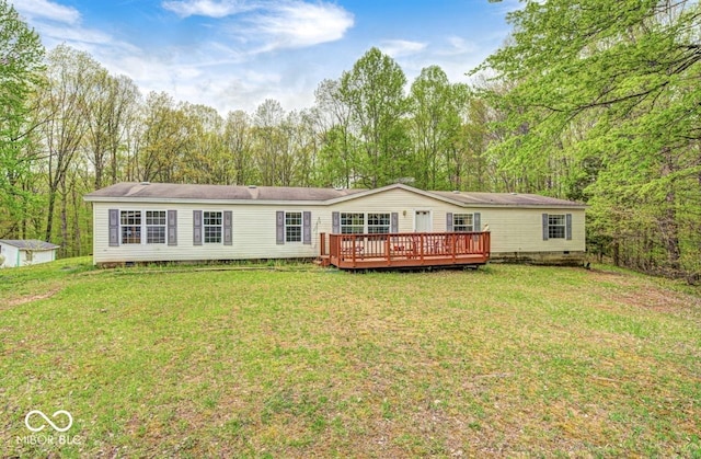 back of house with a lawn, crawl space, and a wooden deck