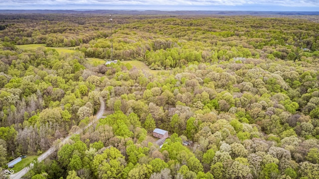 birds eye view of property with a wooded view