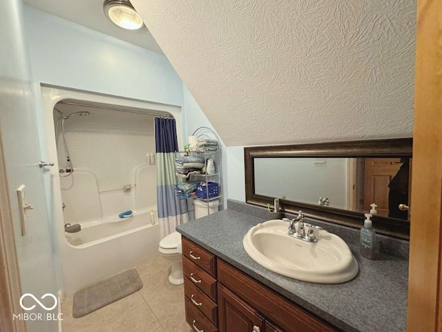 full bath featuring shower / bath combo, vanity, toilet, a textured ceiling, and tile patterned floors