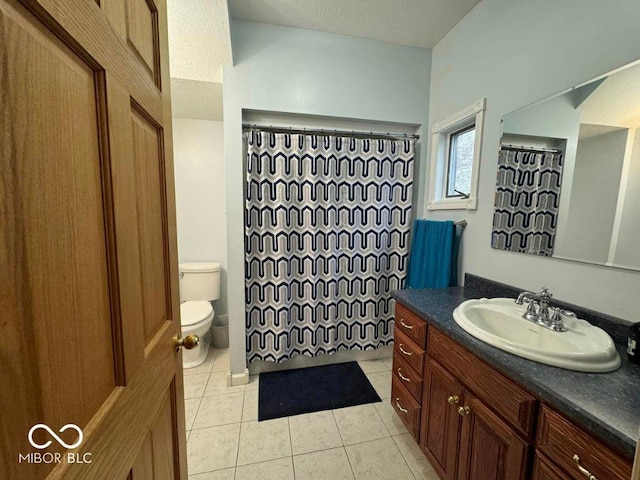 bathroom featuring vanity, tile patterned floors, toilet, and a shower with curtain