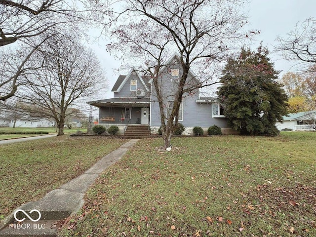 view of front of property featuring covered porch and a front lawn