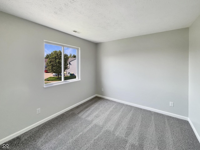 6628 Dunsdin Dr, Plainfield, IN 46168 - carpeted spare room featuring baseboards, a textured ceiling, and visible vents