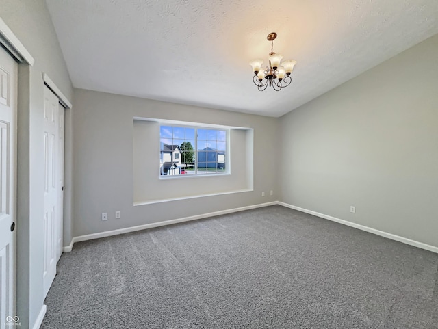 6628 Dunsdin Dr, Plainfield, IN 46168 - unfurnished bedroom featuring carpet floors, baseboards, and a notable chandelier