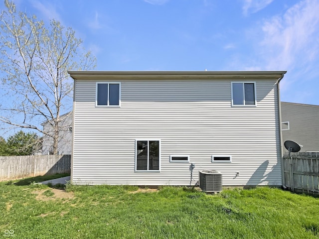 6628 Dunsdin Dr, Plainfield, IN 46168 - rear view of house with a lawn, central AC unit, and fence