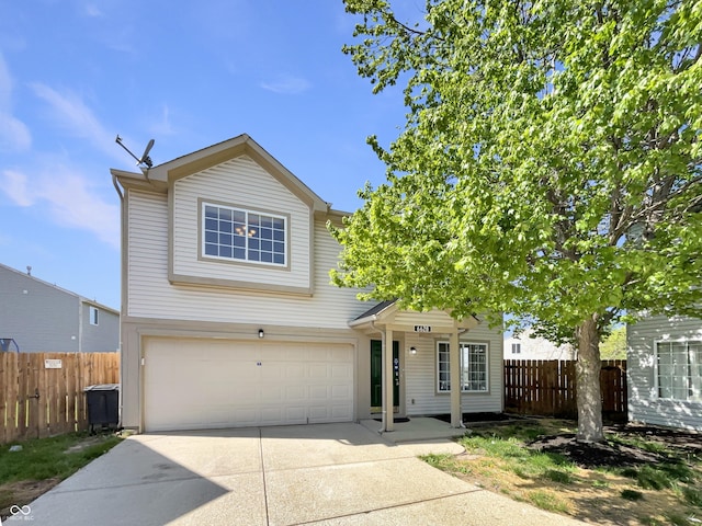 6628 Dunsdin Dr, Plainfield, IN 46168 - traditional-style house with concrete driveway, an attached garage, and fence