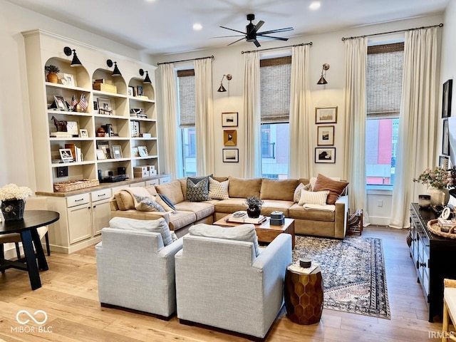 living room featuring recessed lighting, ceiling fan, and light wood finished floors