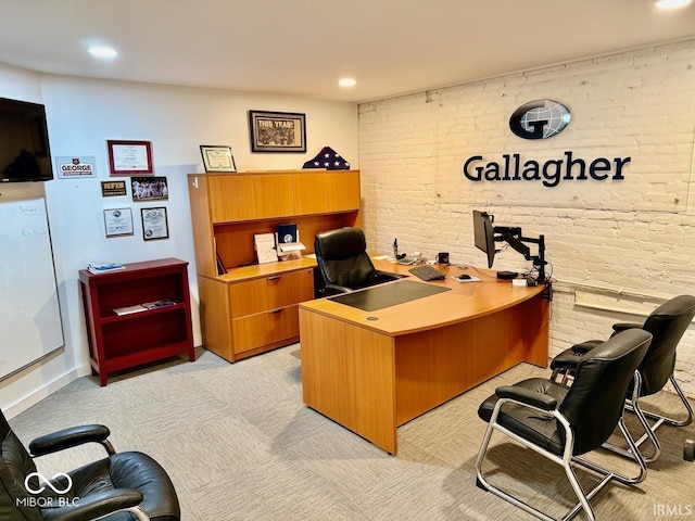 home office with recessed lighting and brick wall