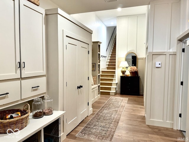 mudroom with visible vents and light wood-style flooring
