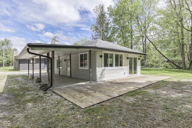 back of property featuring a wooden deck