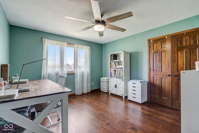 office space with baseboards, a ceiling fan, and wood finished floors
