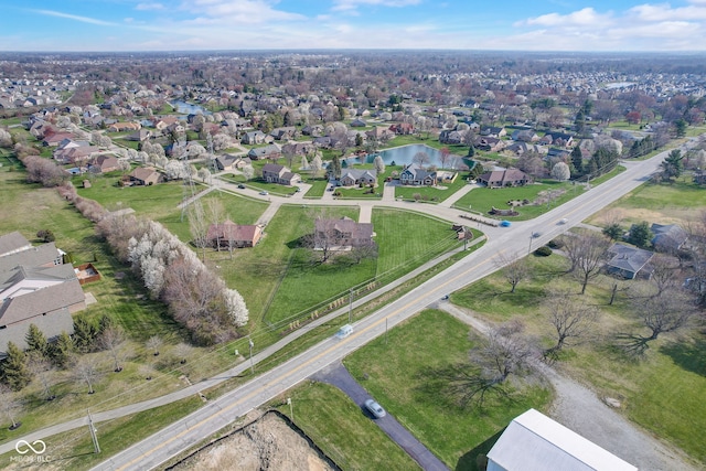 aerial view featuring a water view and a residential view
