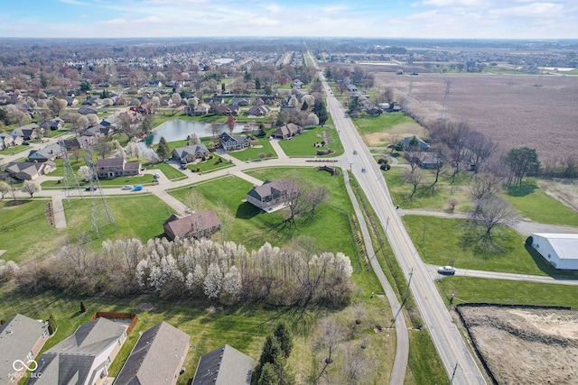 aerial view featuring a water view and a residential view