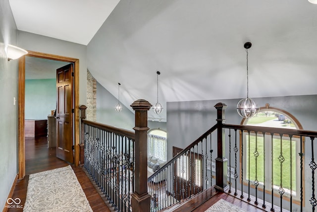 interior space with an inviting chandelier, wood finished floors, and a wealth of natural light