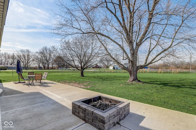view of patio / terrace with an outdoor fire pit