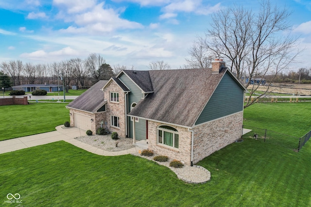view of front of property with a garage, a front lawn, a chimney, a shingled roof, and concrete driveway