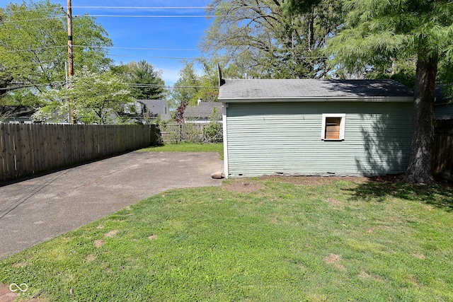 exterior space featuring fence and an outdoor structure