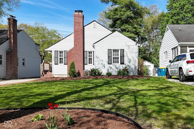 view of front of property with a front lawn and a chimney