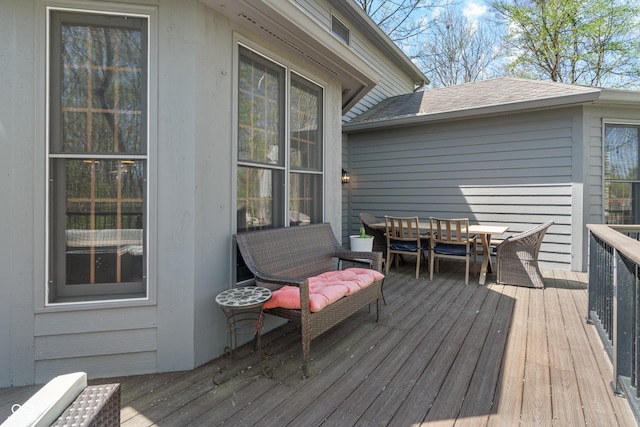 wooden deck with outdoor dining space