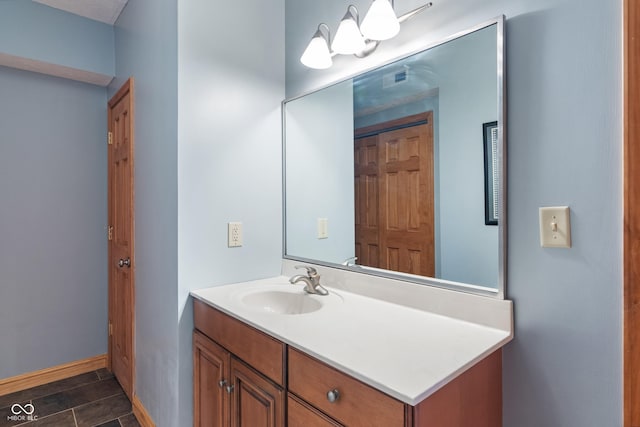 bathroom featuring vanity and baseboards