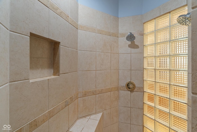 full bathroom with tiled shower
