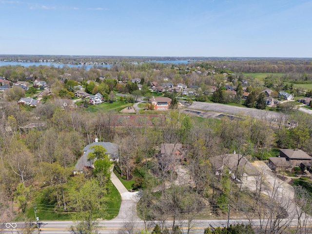 bird's eye view featuring a water view and a residential view