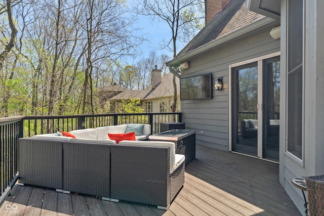 wooden terrace with outdoor lounge area