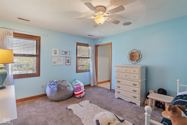 bedroom featuring carpet floors, a ceiling fan, baseboards, visible vents, and a closet