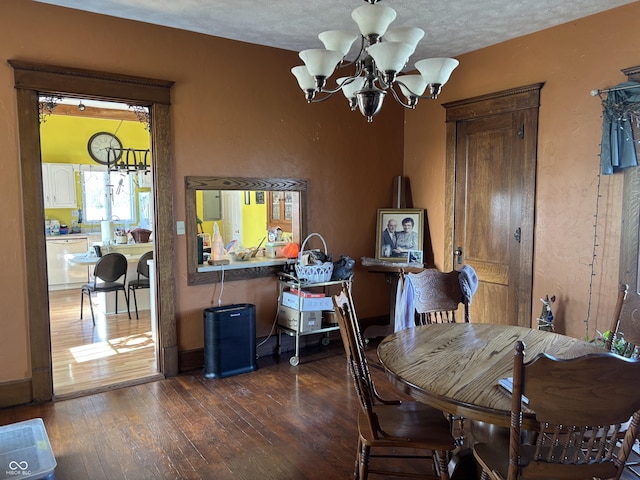 dining space featuring a chandelier and hardwood / wood-style floors