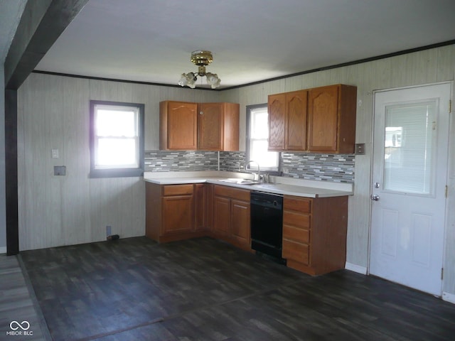 215 W N G St, Gas City, IN 46933 - kitchen featuring brown cabinets, a sink, light countertops, black dishwasher, and dark wood-type flooring