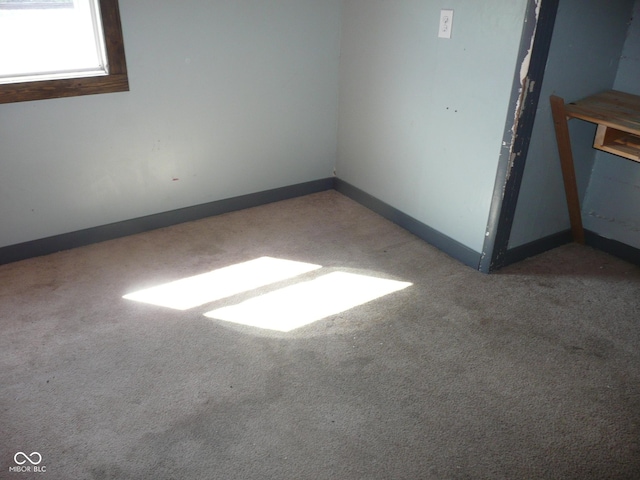 215 W N G St, Gas City, IN 46933 - spare room featuring carpet floors and baseboards