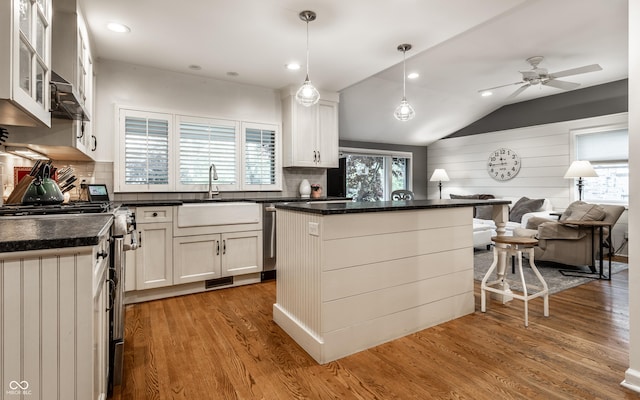 440 E 82nd St, Indianapolis, IN 46240 - kitchen featuring gas stove, a sink, a center island, backsplash, and lofted ceiling