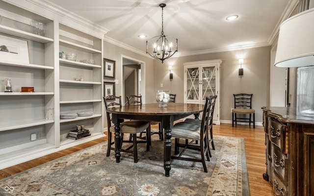 440 E 82nd St, Indianapolis, IN 46240 - dining space featuring a chandelier, ornamental molding, wood finished floors, and baseboards