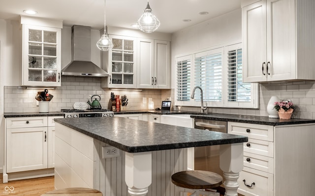 440 E 82nd St, Indianapolis, IN 46240 - kitchen featuring wall chimney exhaust hood, dark countertops, dishwasher, a center island, and recessed lighting