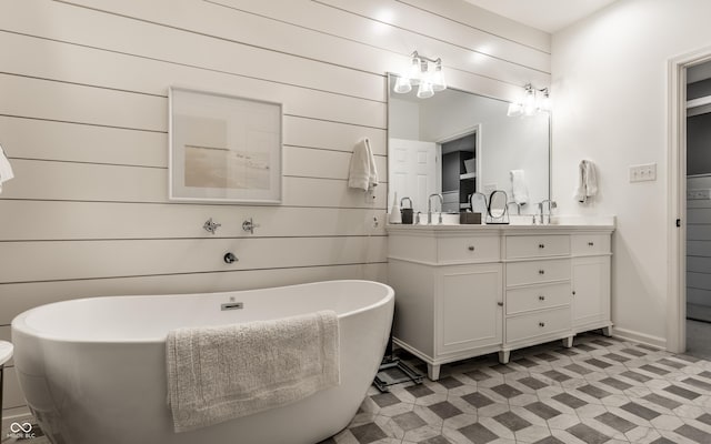 440 E 82nd St, Indianapolis, IN 46240 - bathroom with vanity, a freestanding bath, wood walls, and baseboards