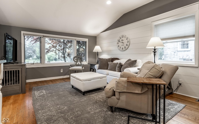 440 E 82nd St, Indianapolis, IN 46240 - living room featuring healthy amount of natural light, vaulted ceiling, wood finished floors, and baseboards