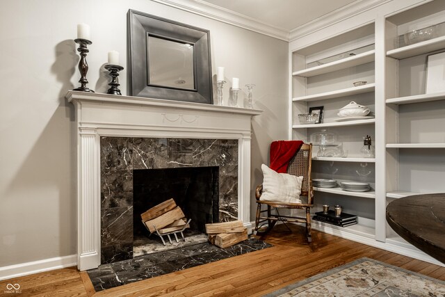 440 E 82nd St, Indianapolis, IN 46240 - living area with wood finished floors, crown molding, a premium fireplace, and baseboards