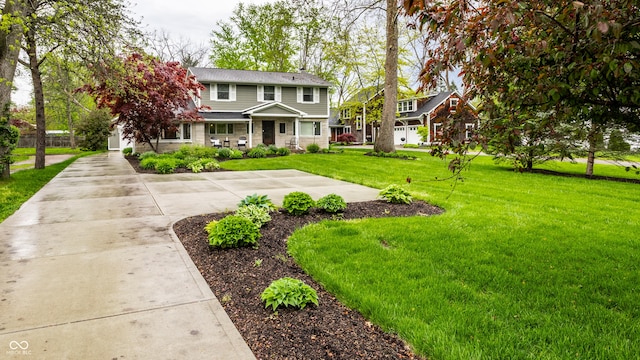 440 E 82nd St, Indianapolis, IN 46240 - view of front of property with a front yard and concrete driveway