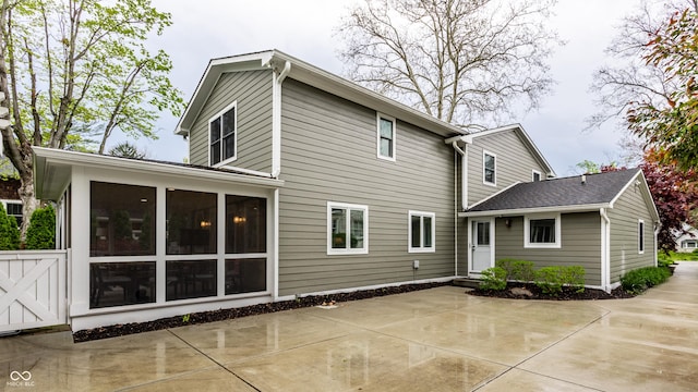 440 E 82nd St, Indianapolis, IN 46240 - rear view of property featuring a sunroom and a patio area