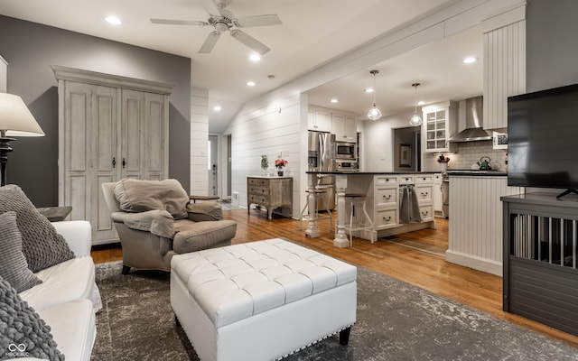 440 E 82nd St, Indianapolis, IN 46240 - living room featuring wood finished floors, recessed lighting, a ceiling fan, and vaulted ceiling