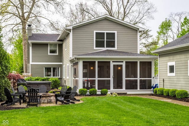 440 E 82nd St, Indianapolis, IN 46240 - rear view of property featuring a sunroom, a chimney, a fire pit, and a hot tub